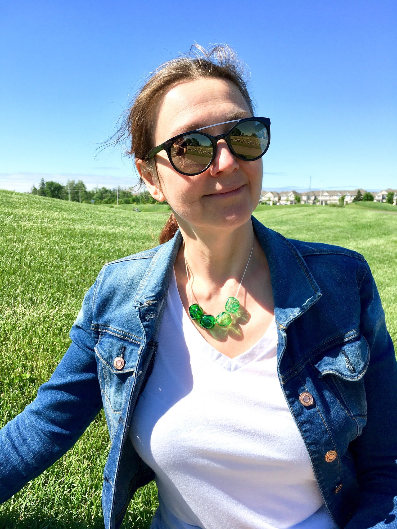 Middle aged woman outdoors wearing sunglasses